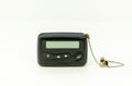 pager in close-up, an old retro communication device on white background Royalty Free Stock Photo