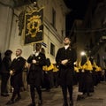 Pages with the banner and hooded faithful for the procession of Chieti, the oldest in Italy