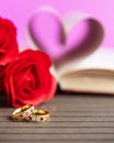 Pages of book curved heart shape with wedding ring Royalty Free Stock Photo