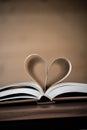 Pages of a book forming the shape of the heart. Love concept. Royalty Free Stock Photo