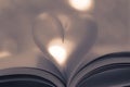 Pages of a book make to curved into a heart shape Royalty Free Stock Photo