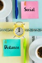 Pages separated by a chain with the words `Social Distance` Clock, office items. The concept of limiting mutual closeness both at Royalty Free Stock Photo