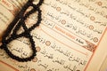 Pages verses from the holy book of islam religion quran and black rosary, kuran and chapters, surah insirah from the Quran