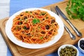 Paghetti with tomato sauce, capers and olives