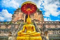 Pagoda and buddha statue at Wat Chedi Luang temple in Chiang Mai Royalty Free Stock Photo