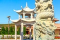 Pagoda, Chinese pillar with dragons, flower beds - the Asian sector in Dubai Safari Park