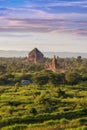 Pagoda landscape of Bagan in misty morning under a warm sunrise in the plain of Bagan Myanmar. Royalty Free Stock Photo