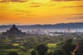 Pagoda landscape of Bagan in misty morning,under a warm sunrise in the plain of Bagan. Royalty Free Stock Photo