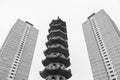 Chinese pagoda between two old blocks of flats Royalty Free Stock Photo