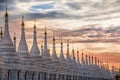 Pagoda series in line at sunset in the Mandalay region, Aungmyaythazan in Burma.