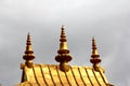 The pagoda/stupa shaped carving on the roof of a Tibetan building, like a temple