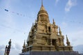 Pagoda yellow gold at Wat Laem Sor of the Buddhist seaside sky b