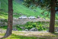 Pahalgam, Jammu & Kashmir, India: Dated- August 20, 2018: Two SUV cars parked in a health resort full of greens Royalty Free Stock Photo