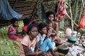 PAHANG, MALAYSIA- DEC 9, 2015 : women and children of the indigenous Malaysian Batek Negritos tribe resting in their