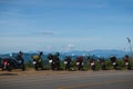 Row of motorbikes parked on the side of the road with beautiful mountain views Royalty Free Stock Photo