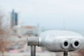 Paid binoculars on the square with a view to the sea