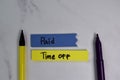 Paid Time Off write on sticky notes isolated on office desk