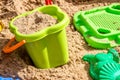 Pail, sieve and molds in the sand in the sandbox, children playground. Royalty Free Stock Photo