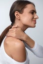 Pain In Body. Beautiful Woman Feeling Pain In Neck And Shoulders Royalty Free Stock Photo