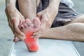 Pain in the foot. Massage of male feet. Royalty Free Stock Photo