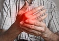 Pain in hand of Asian elder man. Concept of hand pain, arthritis and joint problems Royalty Free Stock Photo