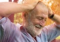 Pain in the head of an old man could be an headache or backache, Health care, Forgetful Senior Royalty Free Stock Photo