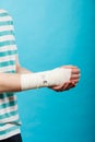 Man with painful bandaged hand. Royalty Free Stock Photo