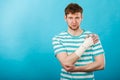 Man with painful bandaged hand. Royalty Free Stock Photo