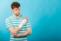 Man with painful bandaged hand. Royalty Free Stock Photo