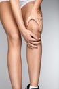 Pain In Knee. Closeup Of Female Leg With Painful Feeling In Knee Royalty Free Stock Photo