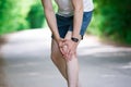 Pain in knee, joint inflammation, massage of male leg, injury while running, trauma during workout Royalty Free Stock Photo