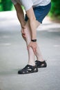 Pain in knee, joint inflammation, massage of male leg, injury while running, trauma during workout Royalty Free Stock Photo