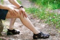 Pain in knee, joint inflammation, massage of male leg, injury while running, trauma during workout Royalty Free Stock Photo