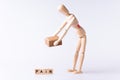 Pain latters with wood man pick up a brown box Royalty Free Stock Photo