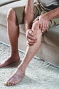 Pain in the legs and knees of an elderly senior Royalty Free Stock Photo