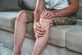 Pain in the legs and knees of an elderly seniorv Royalty Free Stock Photo