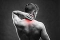 Pain in the neck. Man with backache. Muscular male body. Handsome bodybuilder posing on gray background Royalty Free Stock Photo