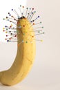 pain: pins and banana Royalty Free Stock Photo