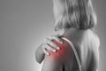 Pain in shoulder, care of female hands, ache in woman`s body Royalty Free Stock Photo