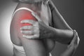 Pain in shoulder, care of female hands, ache in woman`s body Royalty Free Stock Photo