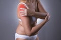 Pain in shoulder, care of female hands, ache in woman`s body Royalty Free Stock Photo