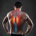 Pain in the spine, a man with backache, injury in the human back, chiropractic treatments concept Royalty Free Stock Photo