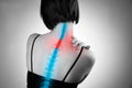 Pain in the spine, woman with backache, injury in the human back and neck Royalty Free Stock Photo