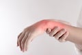 A pain in the woman`s wrist on white background Royalty Free Stock Photo