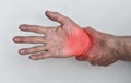 Pain in wrist joint of Asian elder man. Concept of hand pain, osteoarthritis and arm problems Royalty Free Stock Photo