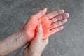 Painful palm of Asian woman. Concept of compartment syndrome, cellulitis and hand muscles pain