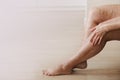 Painful varicose and spider veins on active womans legs, self-helping herself in overcoming the pain. Vascular disease, varicose Royalty Free Stock Photo