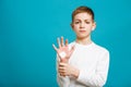 Painfull boy with adhesive plaster on his hand Royalty Free Stock Photo