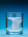 Painkiller dissolving in water Royalty Free Stock Photo