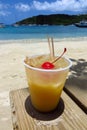 Painkiller tropical rum drink on the beach